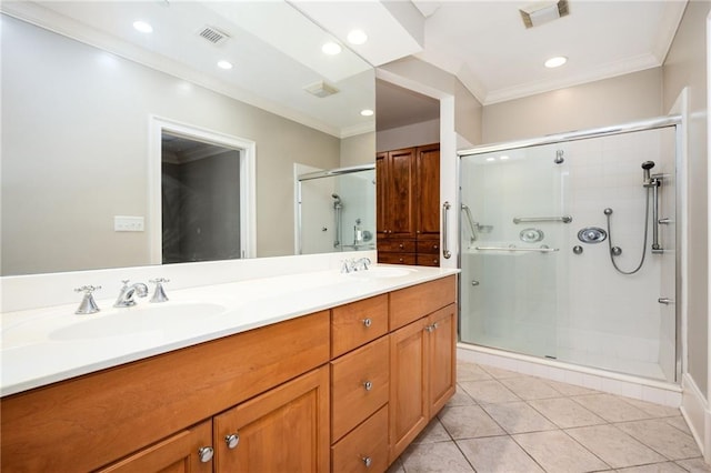 3657 Peachtree Rd NE Unit 4A, Atlanta, GA 30319 - bathroom featuring double vanity, a shower stall, ornamental molding, tile patterned floors, and recessed lighting