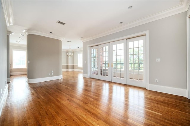 3657 Peachtree Rd NE Unit 4A, Atlanta, GA 30319 - unfurnished room with a chandelier, crown molding, wood finished floors, and french doors