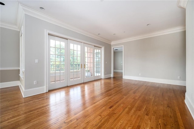 3657 Peachtree Rd NE Unit 4A, Atlanta, GA 30319 - spare room featuring wood finished floors, ornamental molding, and french doors