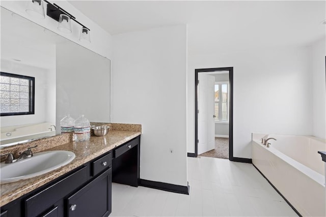 bathroom featuring vanity and a bathtub