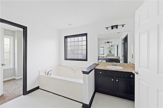 bathroom featuring a bathing tub and vanity