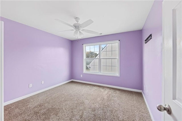 spare room with carpet flooring and ceiling fan