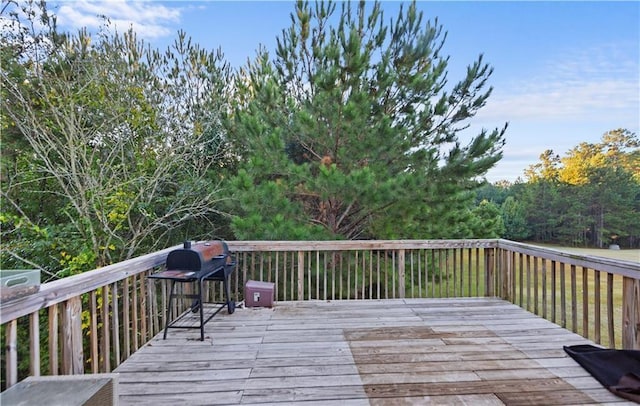 wooden deck featuring a grill