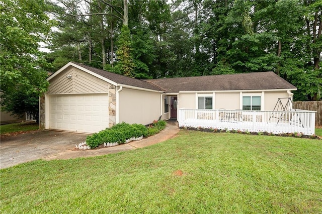 ranch-style home with a front yard and a garage