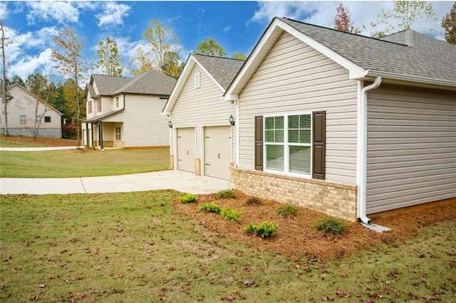 view of front of home featuring a garage and a front lawn