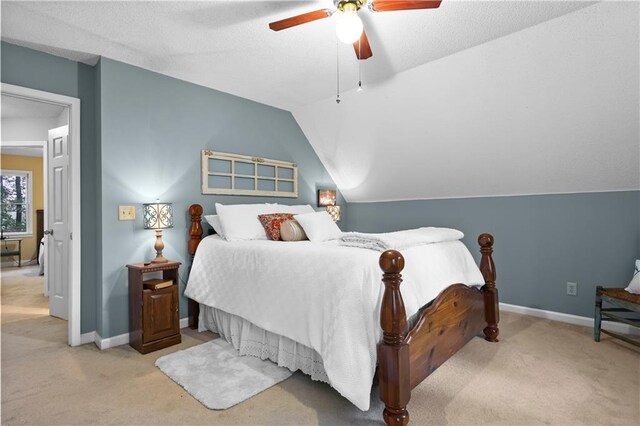 bedroom featuring baseboards, carpet, a ceiling fan, and lofted ceiling