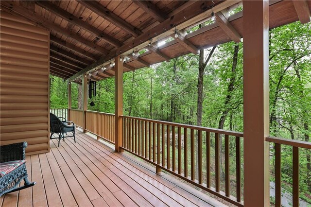 wooden terrace with a forest view