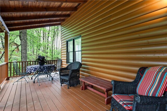deck featuring outdoor dining area