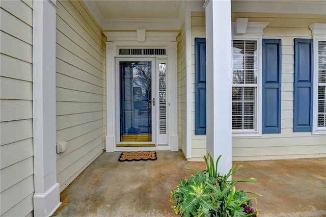 view of exterior entry featuring a porch