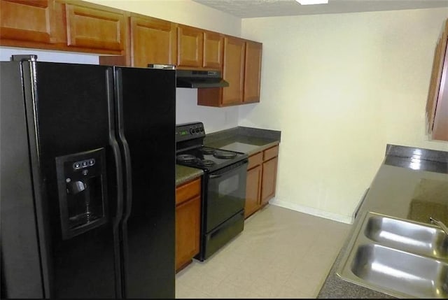 kitchen featuring black appliances and sink