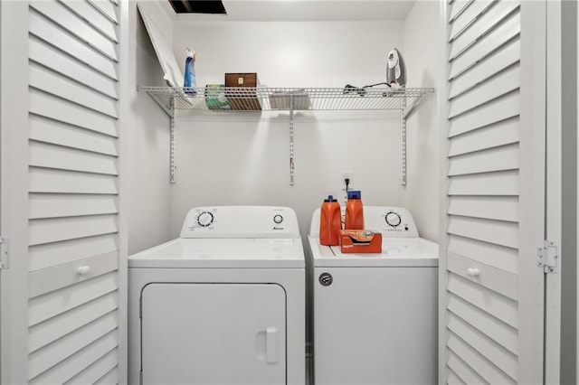 washroom with independent washer and dryer