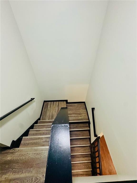 225 Colser Dr, Covington, GA 30016 - stairs with vaulted ceiling and wood finished floors