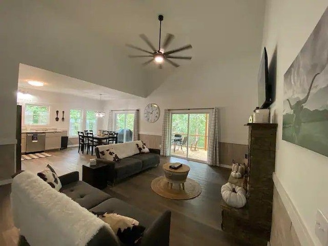 living room with hardwood / wood-style flooring, high vaulted ceiling, and ceiling fan