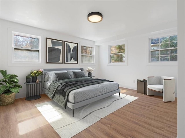 bedroom featuring wood finished floors