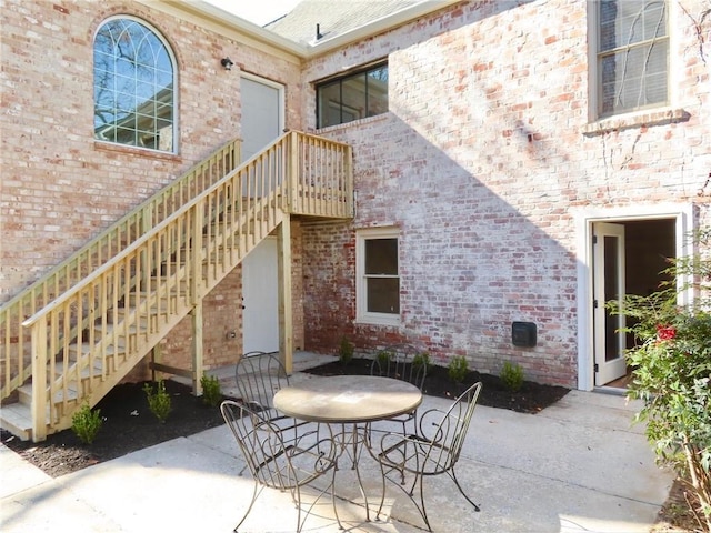 view of patio / terrace featuring stairs