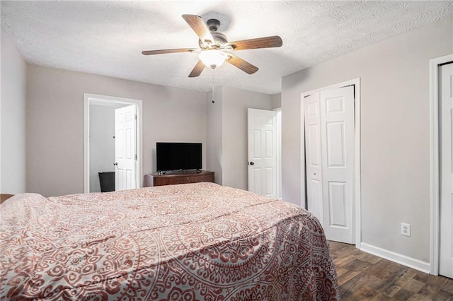 28 Fawn Ct, Sharpsburg, GA 30277 - bedroom featuring dark wood finished floors, a ceiling fan, and a textured ceiling