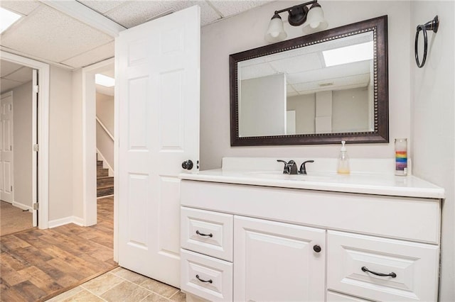 28 Fawn Ct, Sharpsburg, GA 30277 - bathroom featuring a paneled ceiling, vanity, and wood finished floors