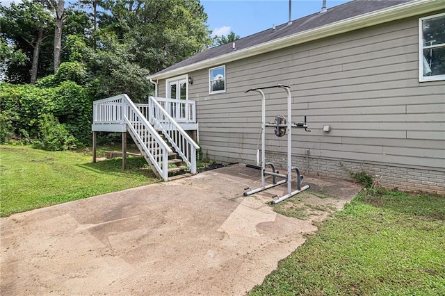28 Fawn Ct, Sharpsburg, GA 30277 - back of property with a lawn, a wooden deck, a patio area, and stairs