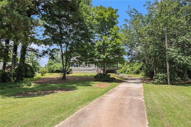 28 Fawn Ct, Sharpsburg, GA 30277 - view of property's community featuring driveway and a yard
