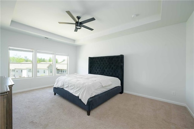 2649 Ogden Trl, Buford, GA 30519 - bedroom featuring a tray ceiling, carpet floors, and baseboards
