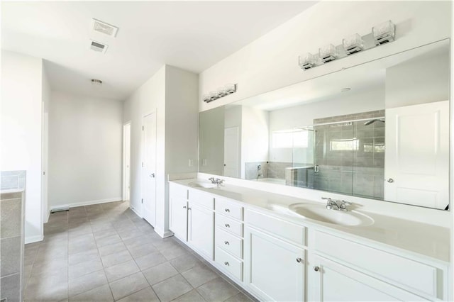 2649 Ogden Trl, Buford, GA 30519 - full bathroom with double vanity, a stall shower, tile patterned floors, and baseboards