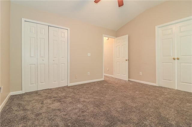 unfurnished bedroom featuring carpet, ceiling fan, and lofted ceiling