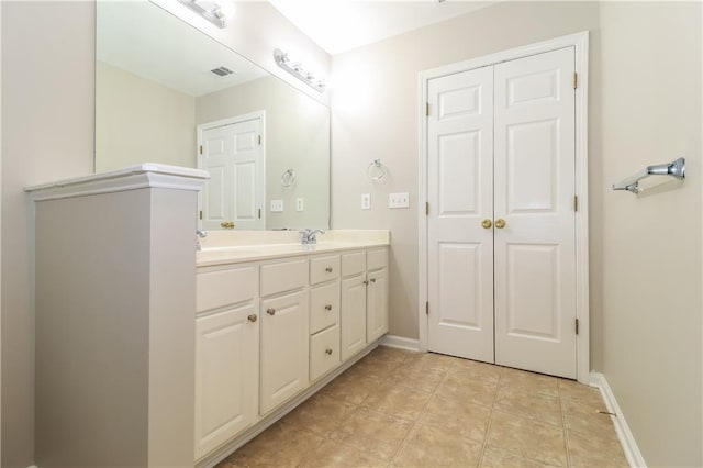 bathroom featuring tile patterned floors and vanity