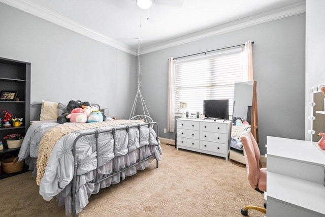 carpeted bedroom featuring ceiling fan and ornamental molding