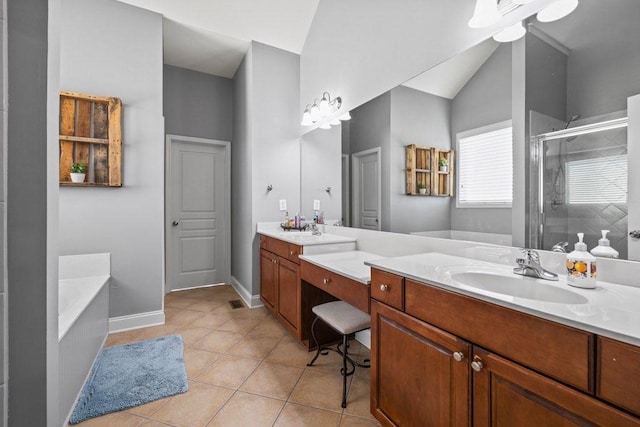 bathroom featuring separate shower and tub, vanity, and tile patterned flooring