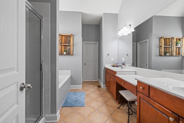 bathroom featuring vanity, tile patterned floors, and shower with separate bathtub