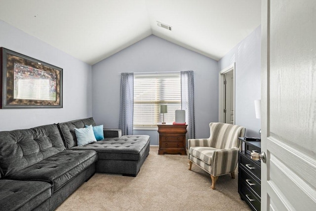 carpeted living room with vaulted ceiling