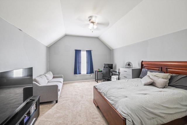 carpeted bedroom featuring ceiling fan and vaulted ceiling