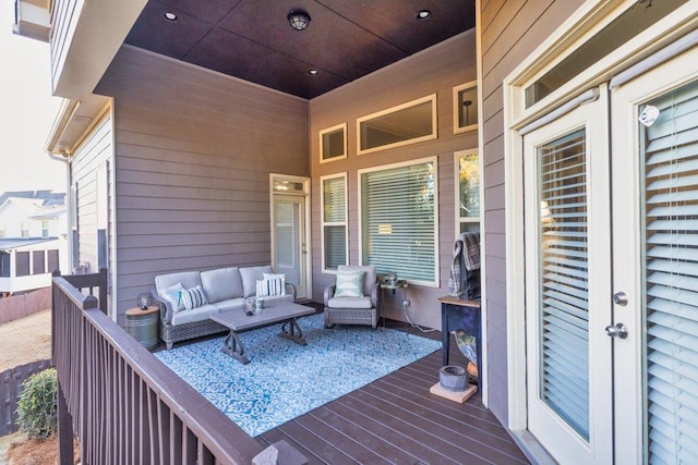 wooden deck with an outdoor hangout area