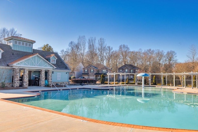 view of swimming pool with a patio