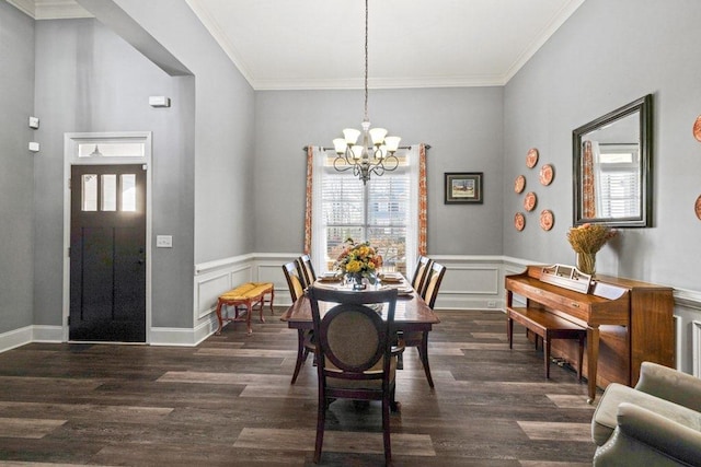 dining area featuring a chandelier, dark hardwood / wood-style floors, and ornamental molding