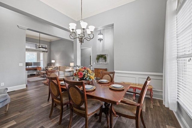 dining room with dark wood-type flooring, crown molding, and an inviting chandelier