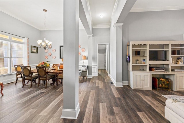 interior space with a chandelier, dark hardwood / wood-style floors, and ornamental molding