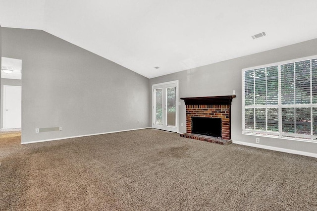 1234 Wellhouse Walk, Stone Mountain, GA 30088 - unfurnished living room with vaulted ceiling, carpet floors, and a brick fireplace