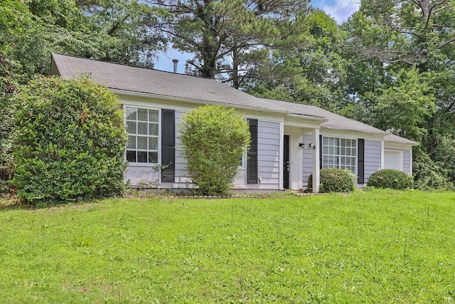 1234 Wellhouse Walk, Stone Mountain, GA 30088 - view of front of home with a front lawn and a garage