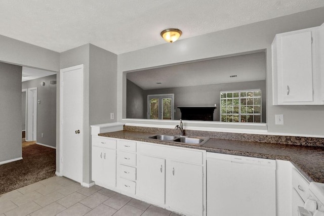 1234 Wellhouse Walk, Stone Mountain, GA 30088 - kitchen with white dishwasher, white cabinets, dark countertops, and a textured ceiling