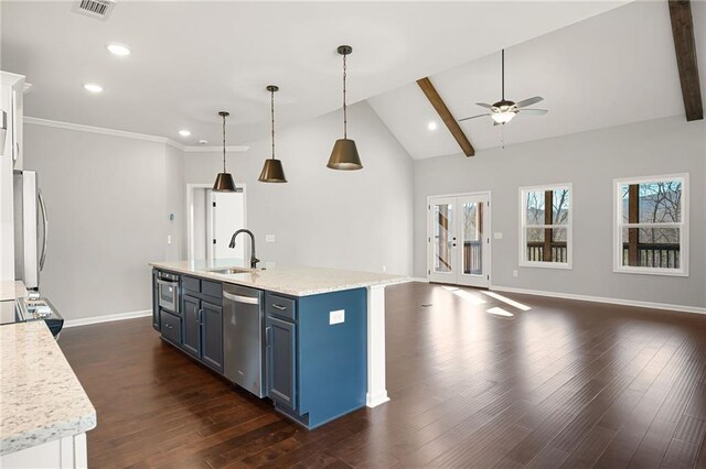 kitchen with decorative light fixtures, white cabinetry, sink, stainless steel appliances, and blue cabinetry