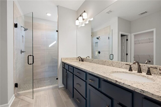 bathroom with vanity and walk in shower