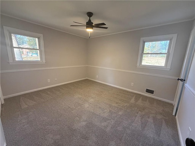 unfurnished room with ornamental molding, ceiling fan, and carpet flooring