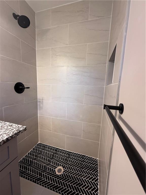 bathroom with a tile shower