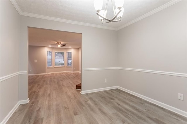 7113 Ambercrest Ct, Austell, GA 30168 - spare room with wood finished floors, a chandelier, baseboards, and ornamental molding