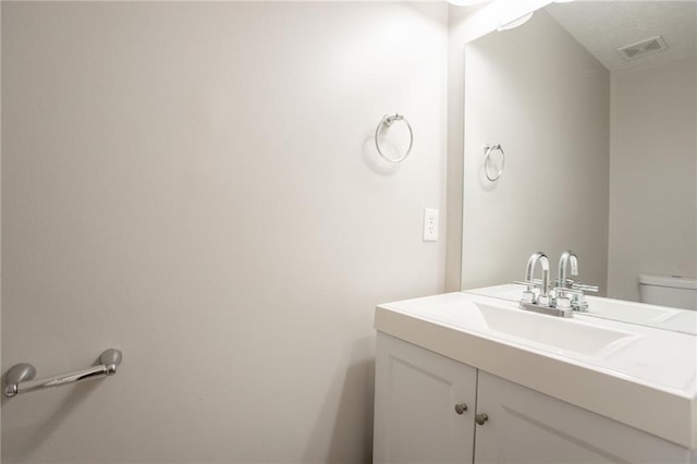 7113 Ambercrest Ct, Austell, GA 30168 - half bathroom featuring vanity and toilet