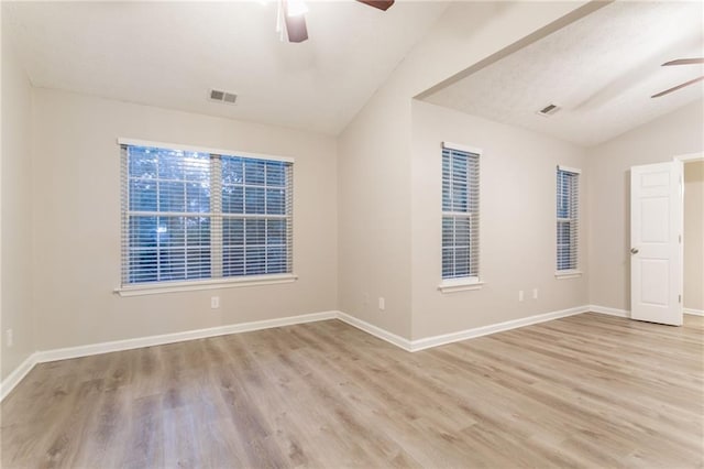 7113 Ambercrest Ct, Austell, GA 30168 - empty room featuring ceiling fan, vaulted ceiling, wood finished floors, and baseboards