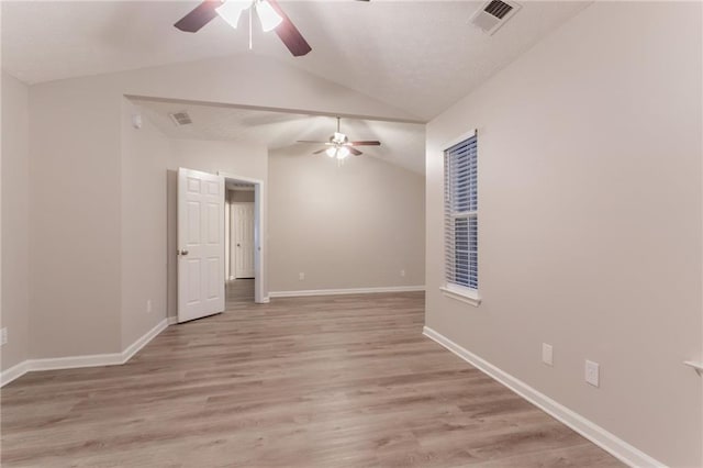 7113 Ambercrest Ct, Austell, GA 30168 - empty room with ceiling fan, vaulted ceiling, light wood-type flooring, and baseboards