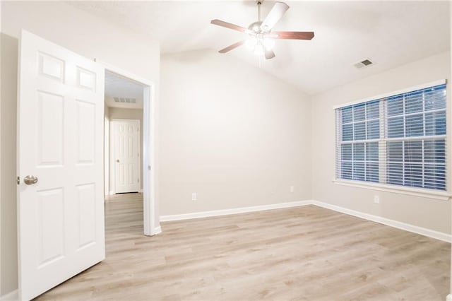 7113 Ambercrest Ct, Austell, GA 30168 - spare room with light wood-type flooring, a ceiling fan, vaulted ceiling, and baseboards
