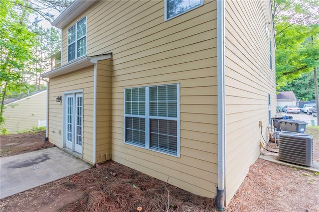 7113 Ambercrest Ct, Austell, GA 30168 - view of side of home with central air condition unit and a patio
